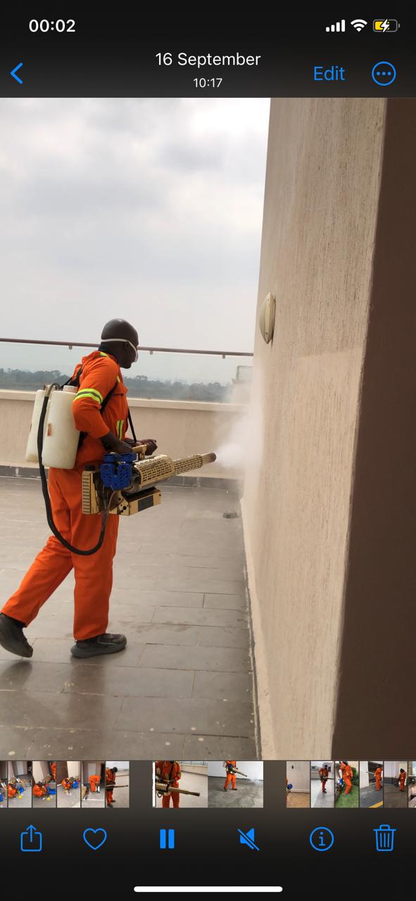 Kowa technician with fogging machine on rooftop