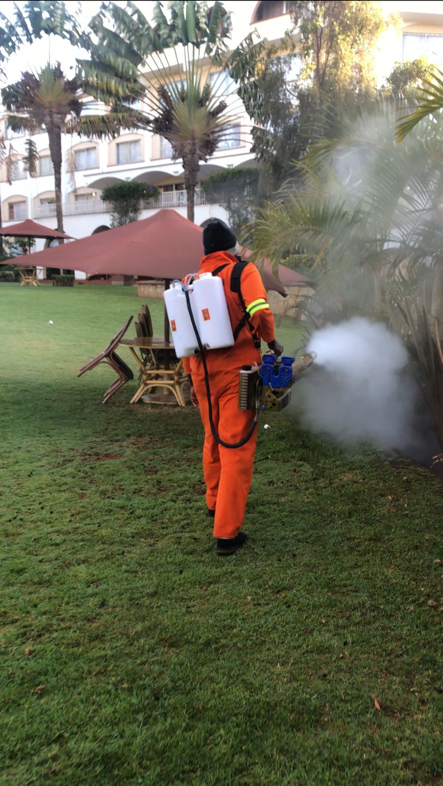 Kowa technician fogging garden for mosquito control