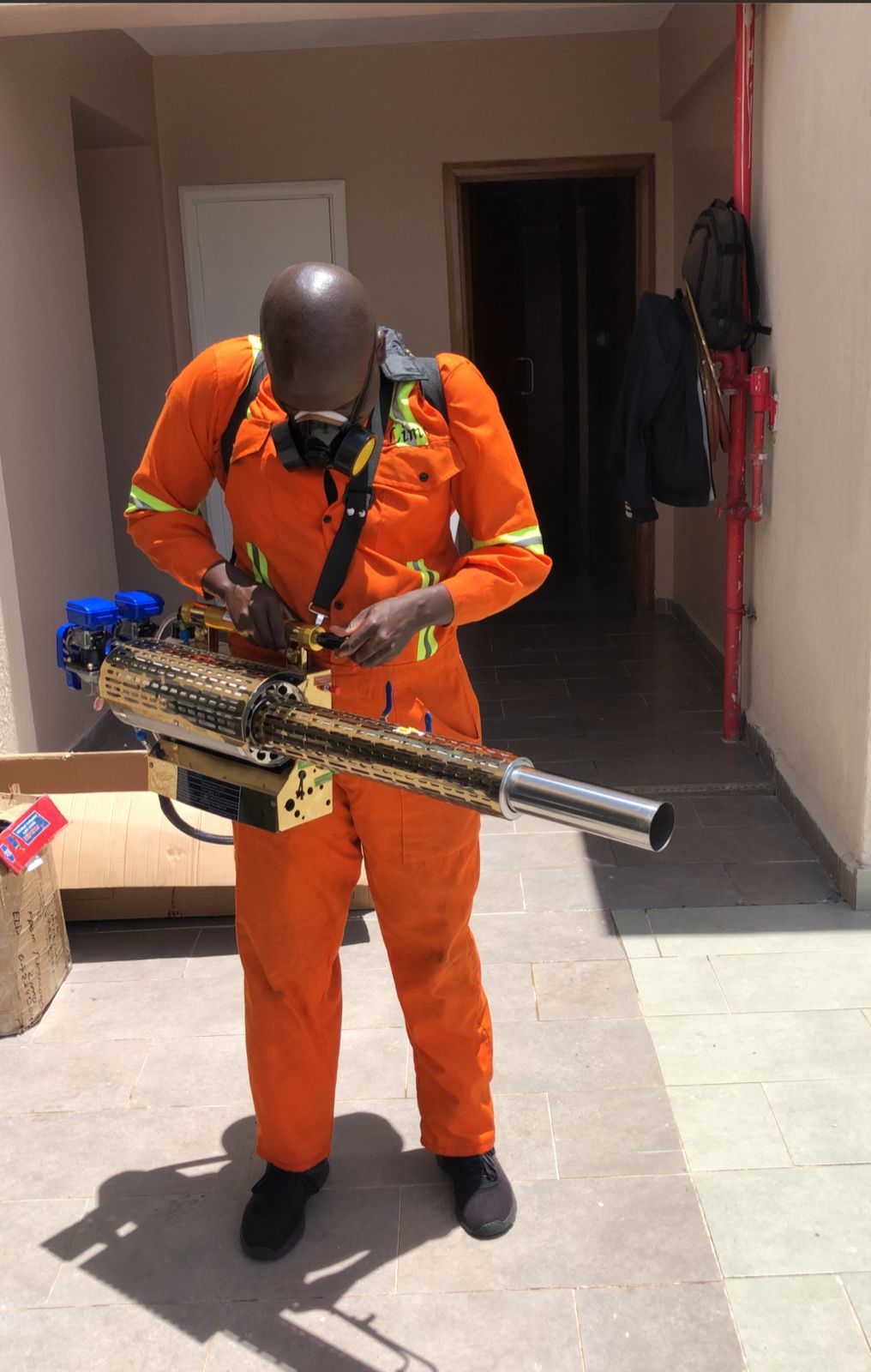 Kowa technician fogging rooftop terrace