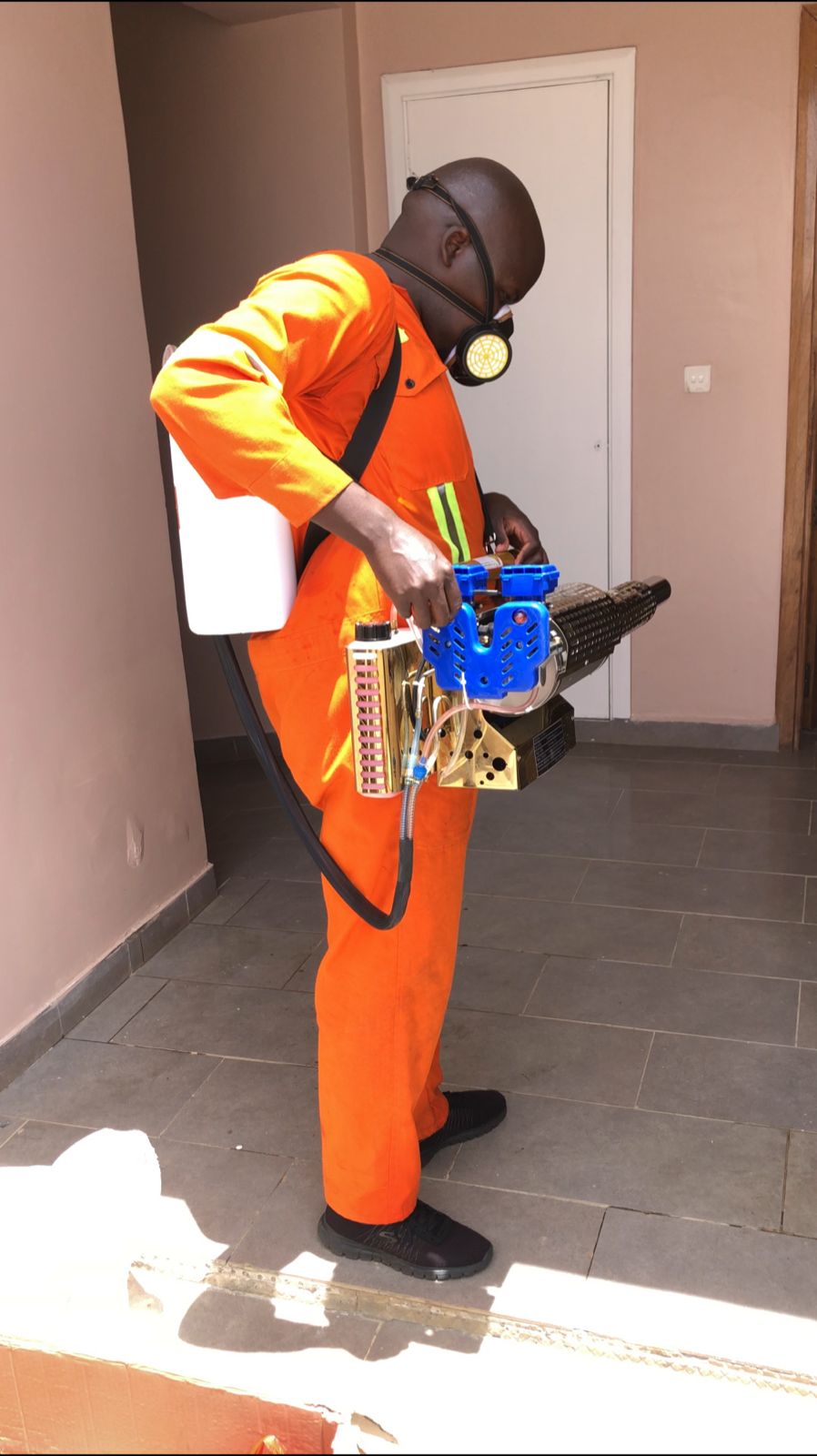 Kowa technician treating under kitchen cabinet
